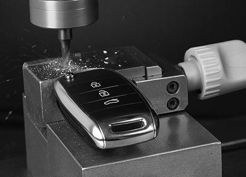 Automotive locksmith cutting and duplicating car keys in Forest Park GA