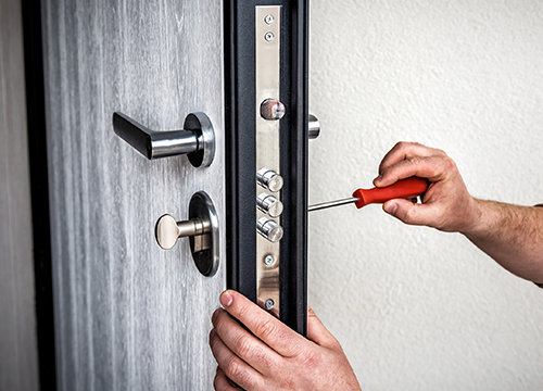Technician exchanging house key outdoors